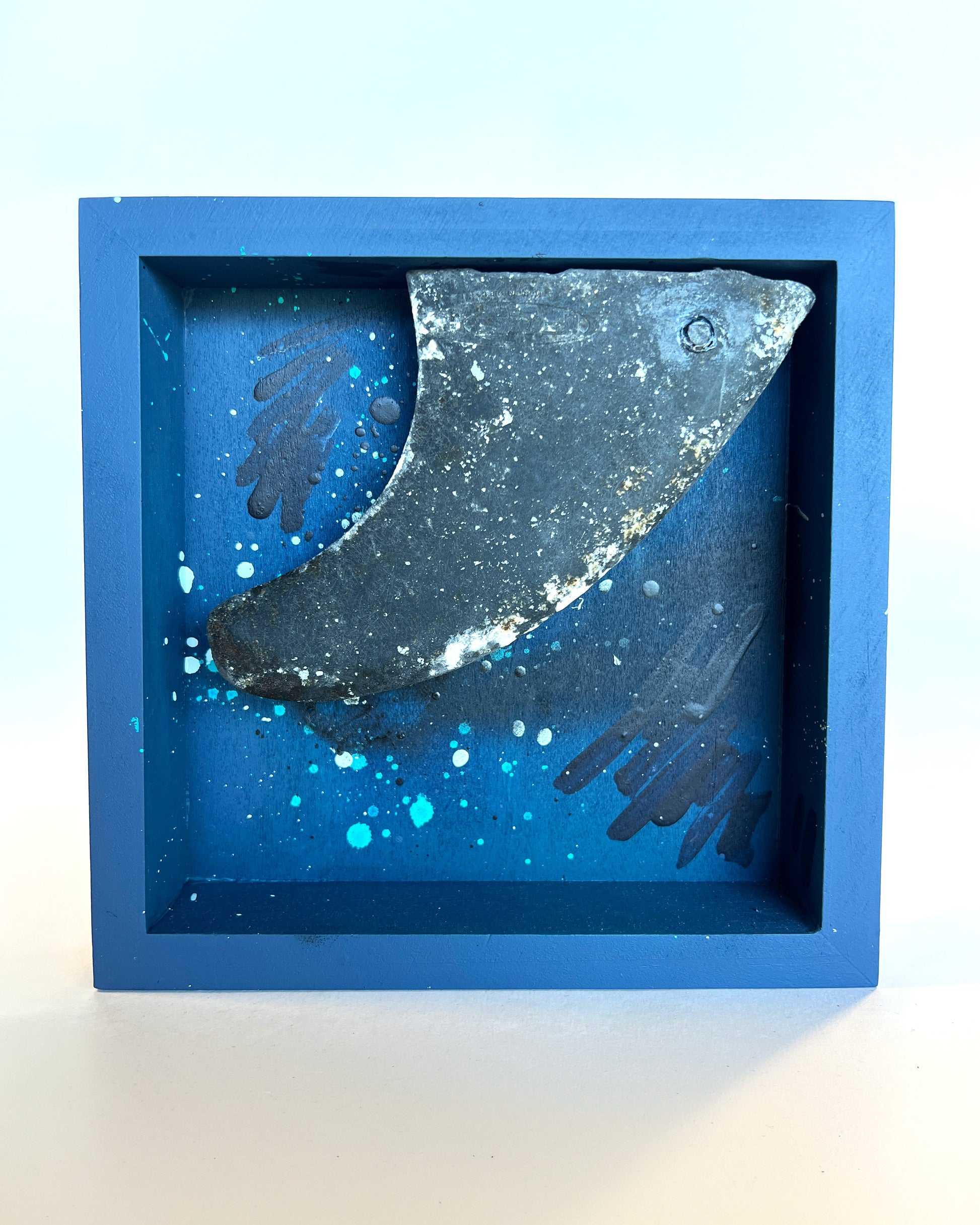 Decorative surf fin sculpture in a blue frame 